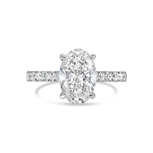 Diamond ring with a oval-shaped center stone on a white background